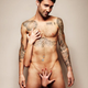 Illustration for article titled Are Your Favorite Male Celebs Still Hot with Belly Button Rings?